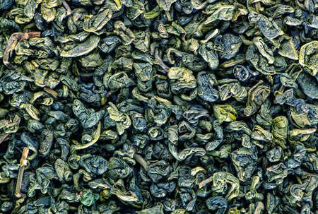 Dry green tea, texture. Aromatic drink rich in antioxidants and tonics. Background.の写真素材
