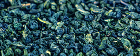 Dry green tea, texture. Aromatic drink rich in antioxidants and tonics. Background.の写真素材