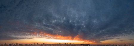 Sunset or dawn, beautiful colored sky with clouds, drone view, bright summer landscape.の写真素材