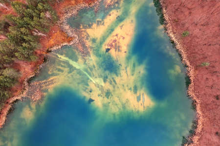 Quarry for mining and enrichment of titanium and other rare ores. Blue water in the enrichment tank.の写真素材