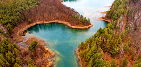 Quarry for mining and enrichment of titanium and other rare ores. Blue water in the enrichment tank.の写真素材