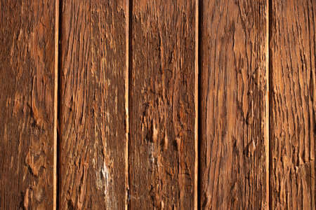 The yellow plank wall is aged naturally.の写真素材