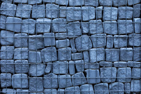 Gray stone gabion. Texture. Durable toast metal mesh.の写真素材