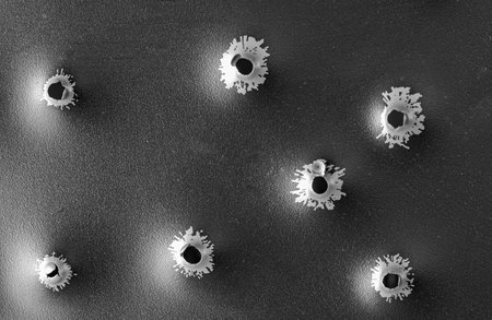 Bullet holes in metal. Concept, use of firearms.の写真素材