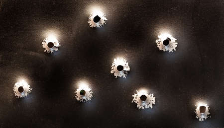 Bullet holes in metal. Concept, use of firearms.の写真素材