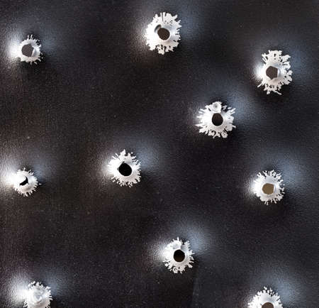Bullet holes in metal. Concept, use of firearms.の写真素材
