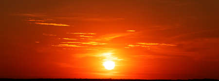 Wonderful summer landscape. Sunset. Bright orange-pink sky at dawn.の写真素材