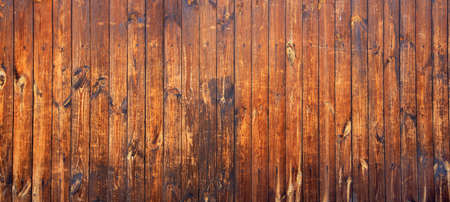 The yellow plank wall is aged naturally.の写真素材