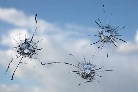 High quality broken glass texture. Hole in dirty glass. On a light background. abstract background.の写真素材