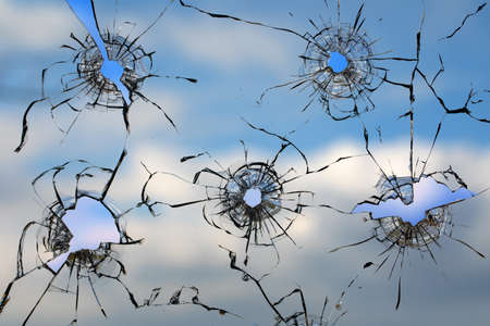 High quality broken glass texture. Hole in dirty glass. On a light background. abstract background.の写真素材