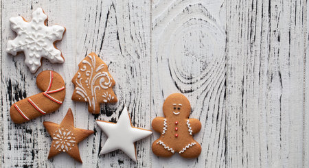Collection of Christmas gingerbread cookies on a white wooden background Christmas texture