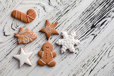 Collection of Christmas gingerbread cookies on a white wooden background Christmas textureの写真素材