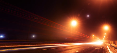 Night street on long exposure. Traces of car headlights.の写真素材