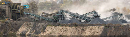 granite factory. Large piles of granite stones near the lake and granite quarry.の写真素材