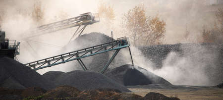 granite factory. Large piles of granite stones near the lake and granite quarry.の写真素材