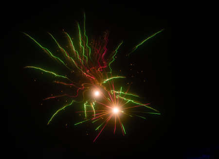 Multicolored fireworks on a background of night sky. holiday background.の写真素材