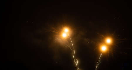 Multicolored fireworks on a background of night sky. holiday background.の写真素材