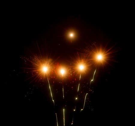 Multicolored fireworks on a background of night sky. holiday background.の写真素材