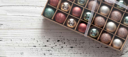 Box with Christmas balls on a white background. top view. Christmas background.の写真素材