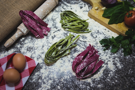Making raw pasta - Green and redの写真素材