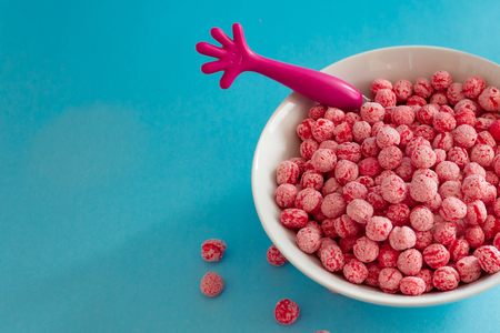 Colorful breakfast for kids, Pink Bowl Cereal with milkの写真素材