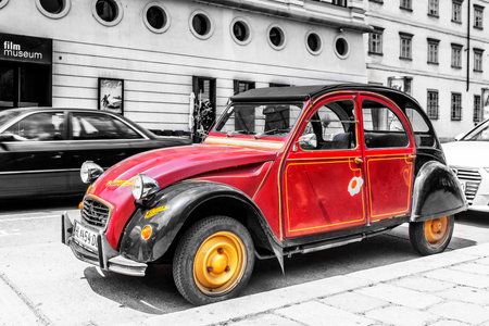 Retro car on the Vienna street on black and white background.