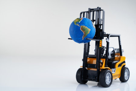 Forklift and globe. The concept of commerce and trade, cargo delivery, exchange of goods. Globalization, markets. Business and industry, transport infrastructureの写真素材