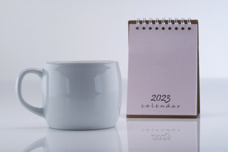 2023 desk caledar and white mugの写真素材