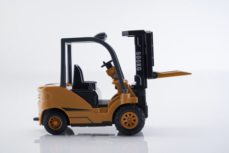 close up of toy forklift against white backgroundの写真素材