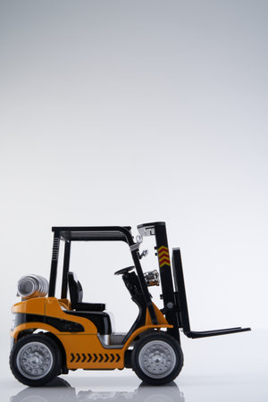 close up of toy forklift against white backgroundの写真素材