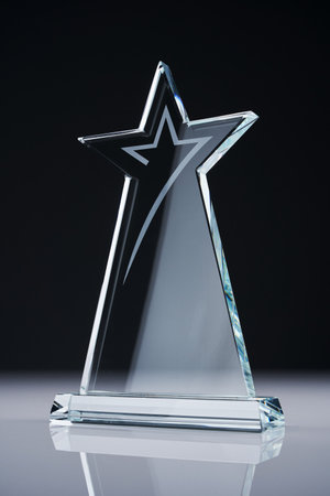 star shape crystal trophy against white backgroundの写真素材