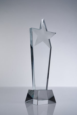 star shape crystal trophy against white backgroundの写真素材