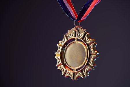 wining gold colored trophy on red purple backgroundの写真素材