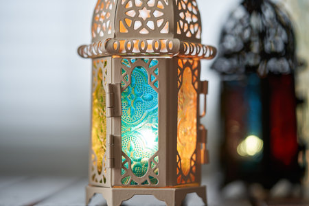Ornamental Arabic lantern with burning candle glowing in dark  Muslim holy month Ramadan Kareem festiveの写真素材