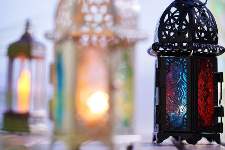 Ornamental Arabic lantern with burning candle glowing in dark  Muslim holy month Ramadan Kareem festiveの写真素材