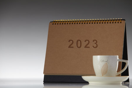 Calendar desk 2022 for organizer to planning and cup of coffeeの写真素材