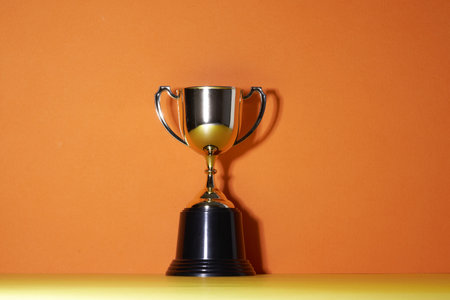 close up of golden trophyon orange backgroundの写真素材