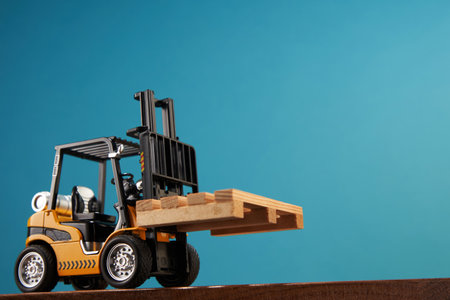 toy forklift on blue backgroundの写真素材