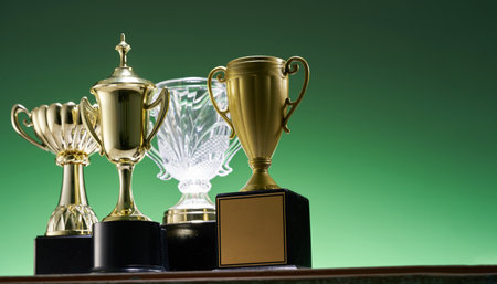 low angle view winning trophy against green backgroundの写真素材