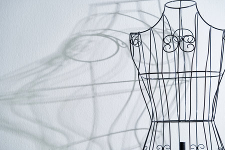 Stylish wire tailor's mannequin isolated on whiteの写真素材