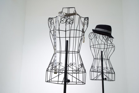Stylish wire tailor's mannequin isolated on whiteの写真素材