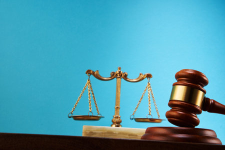 libra scale and gavel hammer against blue background with copy spaceの写真素材