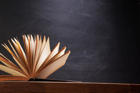 Book Fanned Isolated on blackboardの写真素材