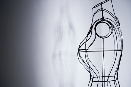 Stylish wire tailor's mannequin isolated on whiteの写真素材