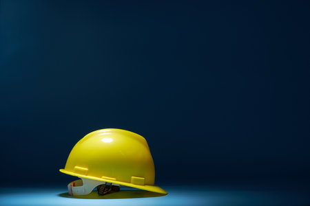 yellow hard hat against blue backgroundの写真素材