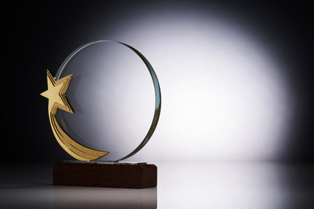 star shape of crystal glass trophy against gray backgroundの写真素材