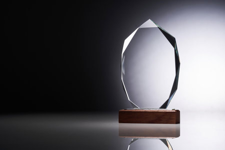 Crystal or glass trophy against gray backgroundの写真素材