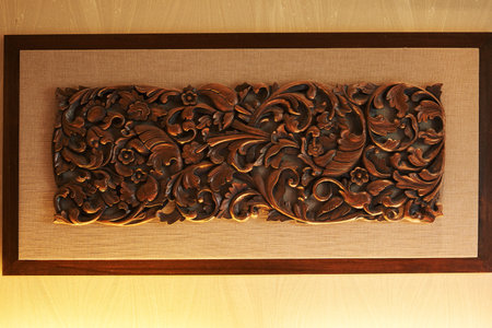 Pattern of flower carved on wood background
