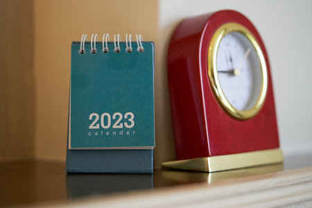 desk calendar with vintage alarm clockの写真素材