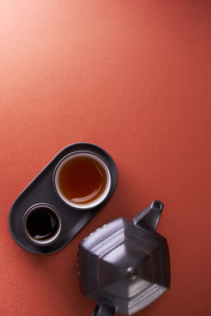 top view chinese tea cup and teapot against red backgroundの写真素材